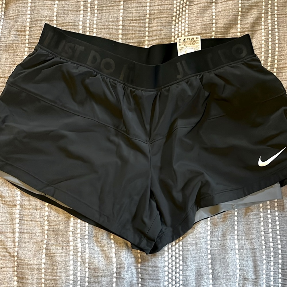 Black Nike shorts, size L